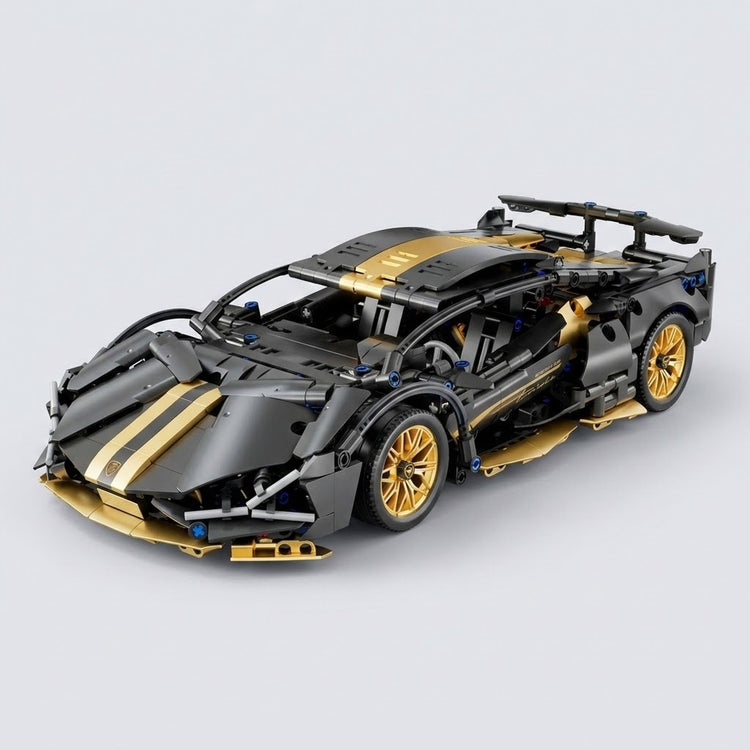 An assembled black and gold car building kit shows gold wheels, hood stripes, and a rear spoiler against a light gray background.