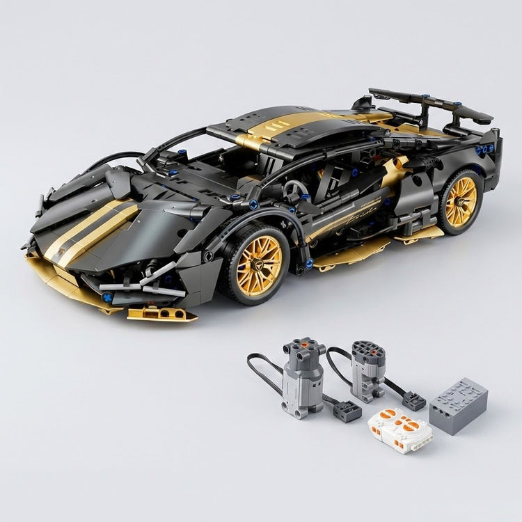 Assembled black and gold car building kit sits behind two wired motors, a white controller, and gray component on a light gray background.