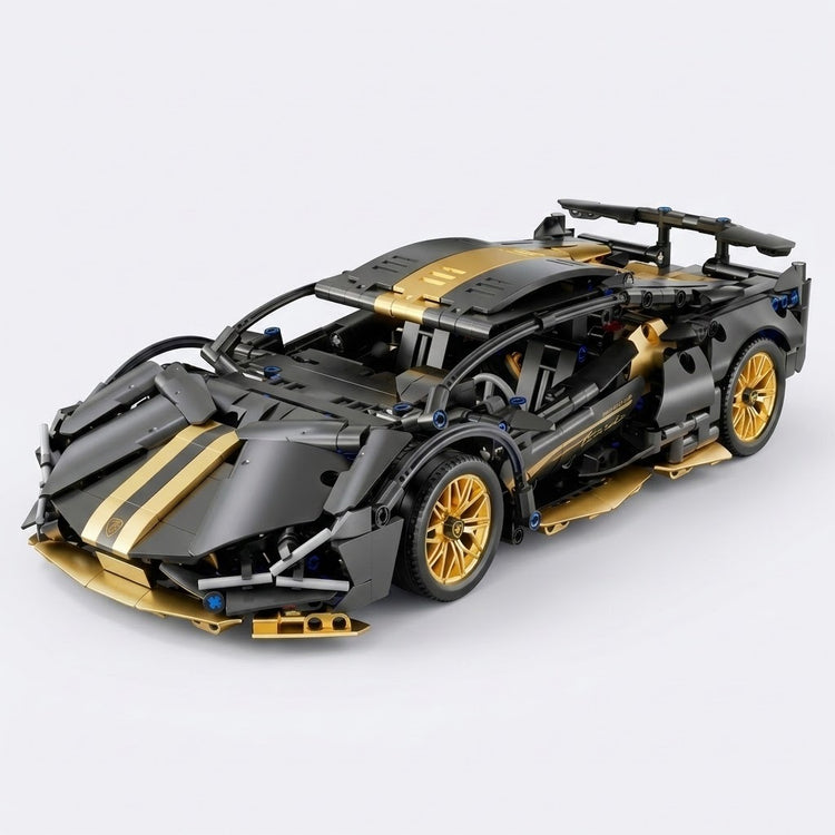 Black and gold car building kit shown assembled from a three-quarter angle, with gold wheels and rear spoiler against light gray.