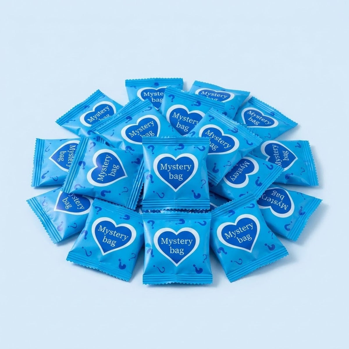 Blind bags for resin miniature figurines form a spread on pale blue, with blue wrappers displaying heart-shaped mystery bag labels.