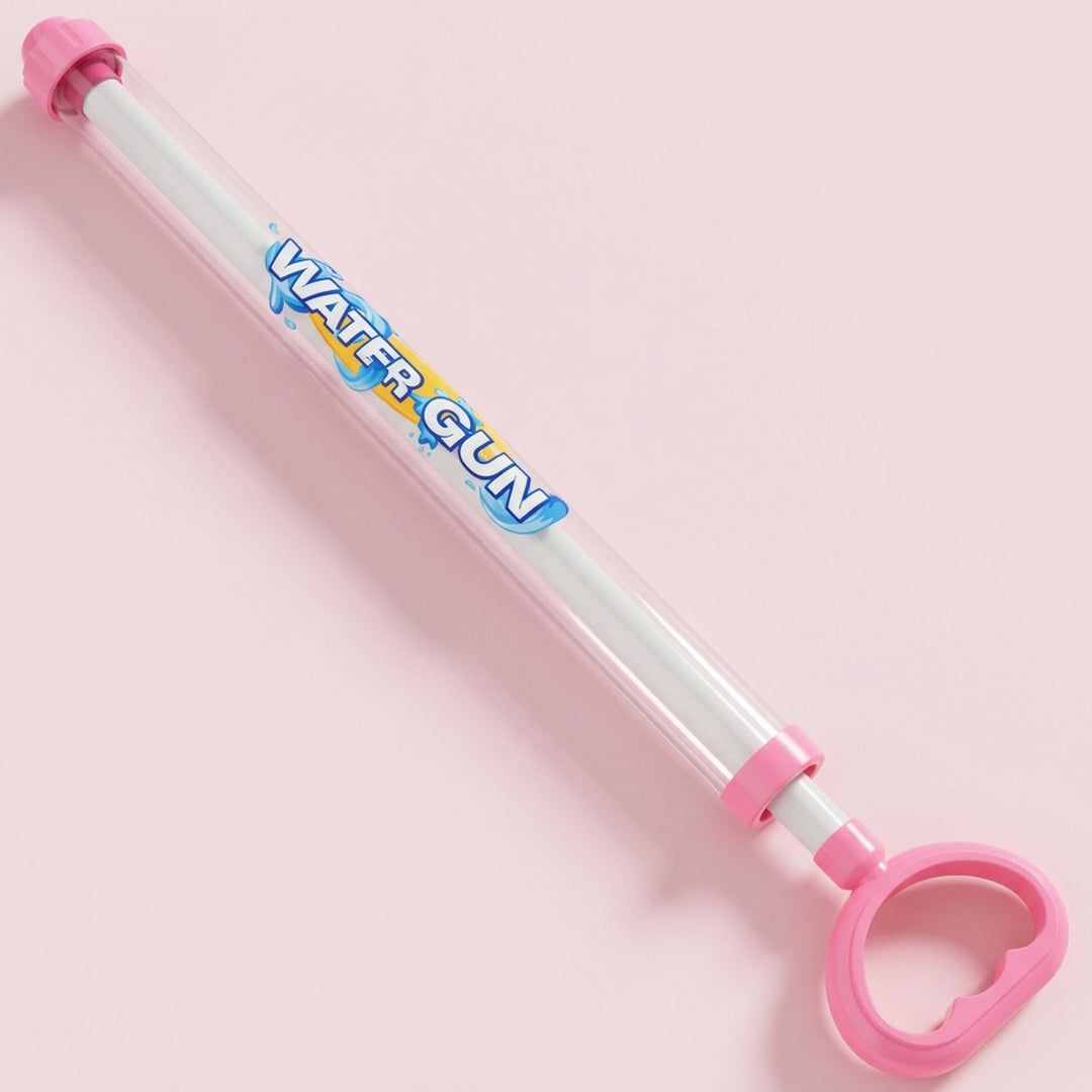 A pink and clear plastic hand-pump water gun toy with a pink trigger handle and pink nozzle, shown on a solid light pink background. The tube has 'WATER GUN' printed on it in blue and yellow.