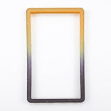 Orange-black slab bumper with pale speckles and an empty rectangular center rests on a white background.