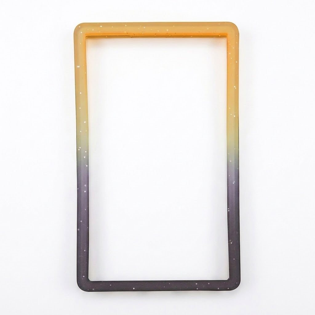 Orange-black slab bumper with pale speckles and an empty rectangular center rests on a white background.