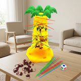Board game with a translucent yellow plastic palm tree and colorful sticks set up on a wooden coffee table in a living room.