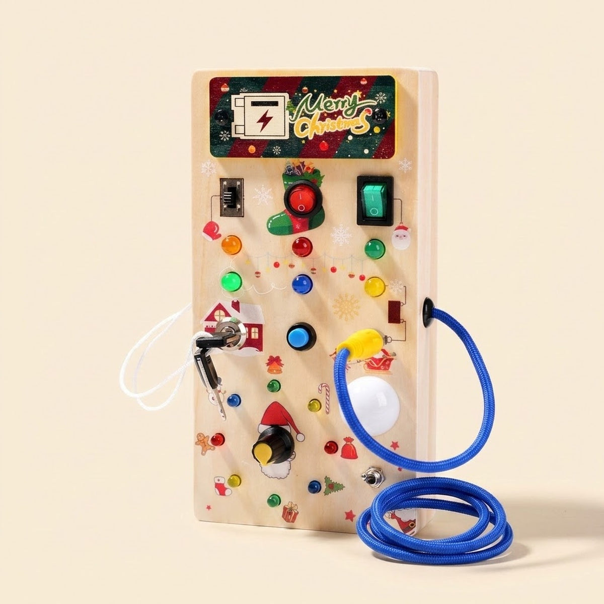 Christmas-decorated wooden busy board with colorful lights, switches, keys, and a coiled blue cord stands against a cream background.