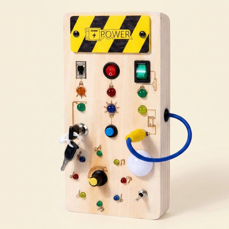 Pale wooden busy board with musical symbols, colorful lights, switches, keys, and a blue looped cord stands against a cream background.