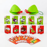 Frog tongue party game includes two green masks, ten upright numbered insect targets, and fanned orange cards against a white background.
