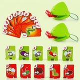 Two-player frog tongue party game with green masks, red tongues, orange numbered cards, and ten insect targets against a pale green background.