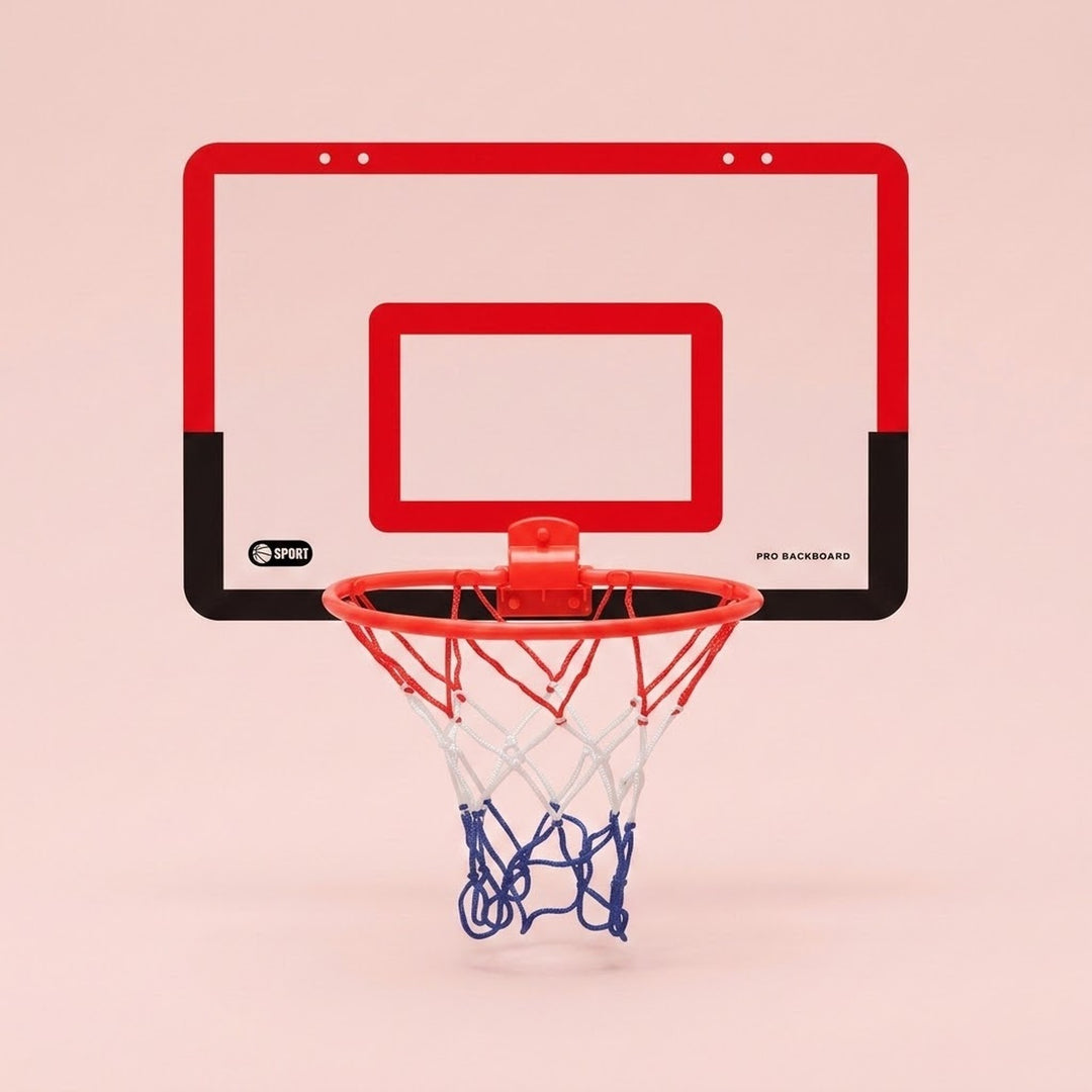 Basketball hoop with a red and black backboard, red rim and red, white and blue net appears against a pale pink background.