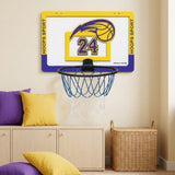 Yellow and purple basketball hoop with number 24, a black rim and blue and white net hangs above cabinets beside a wicker basket.