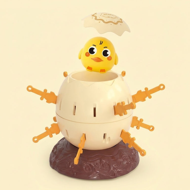 Tabletop game with yellow chick, raised cream lid, cream shell, orange swords, and brown base against a pale yellow background.