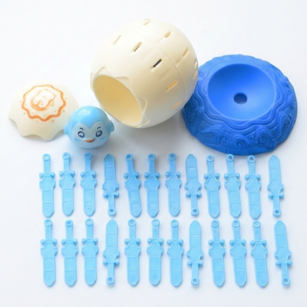 Disassembled tabletop game with cream shell and lid, blue character, blue base, and two rows of light blue swords on white.