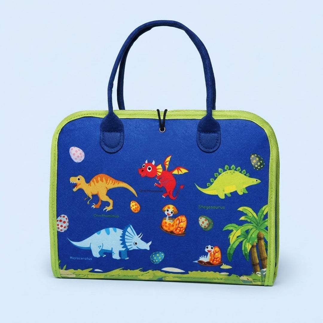 A blue fabric busy board with green trim, navy handles and colourful dinosaur illustrations stands against a pale blue background.