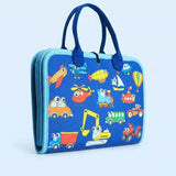 A folded blue fabric busy board with navy handles, light blue trim and colourful vehicle illustrations stands against a pale blue background.