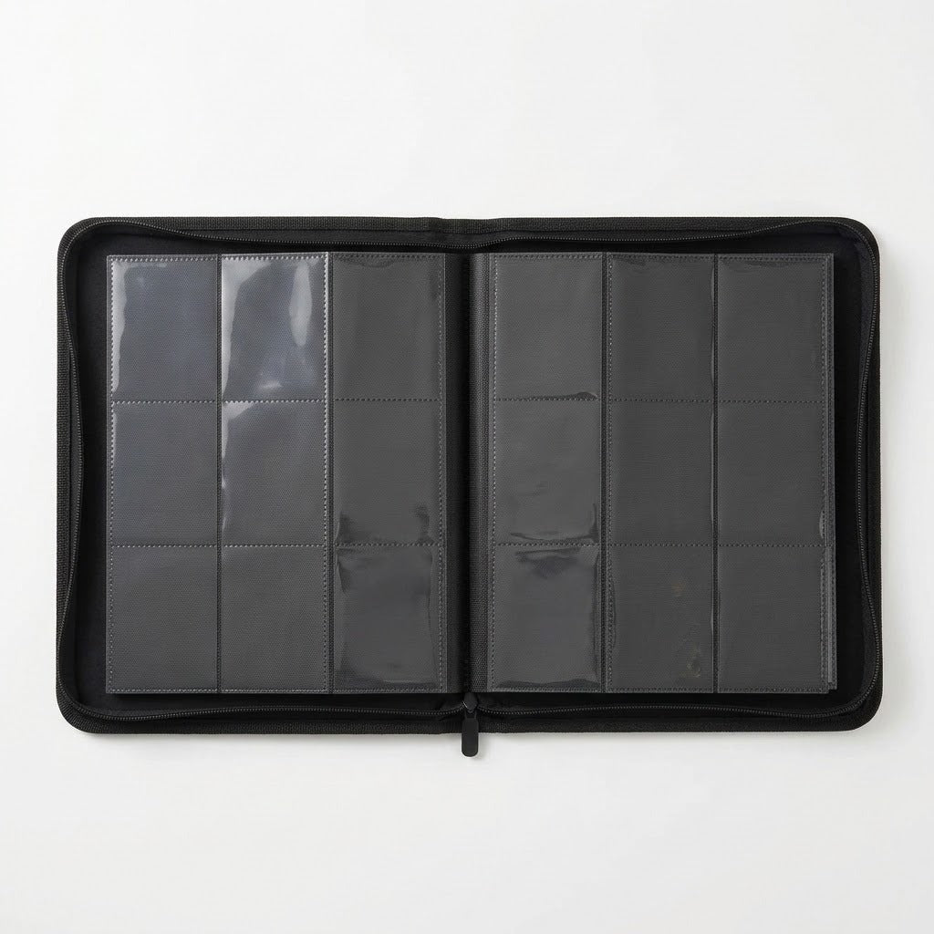 A black trading card binder lies open on a white background, showing two pages with nine clear pockets each.