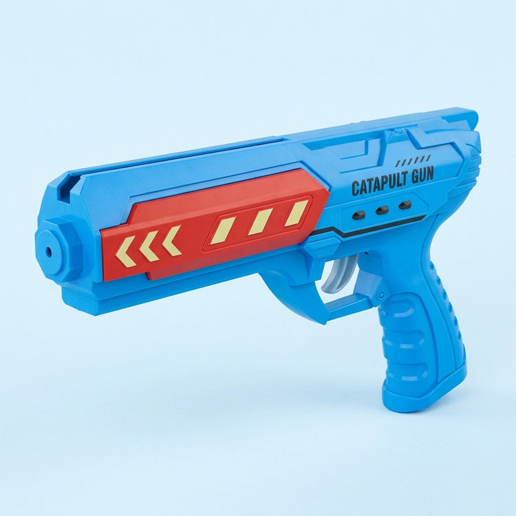 Blue plastic airplane launcher toy with a red side panel, yellow arrows, and gray trigger against a pale blue background.