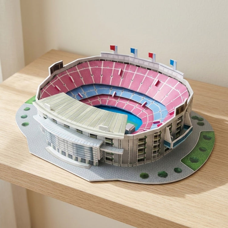 A plastic 3D stadium puzzle with pink and blue seating sits on a wooden shelf against a cream wall.