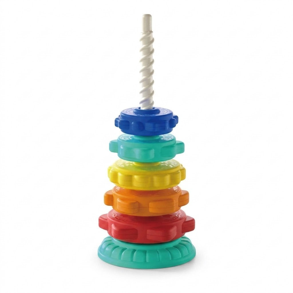 A plastic stacking toy has five colorful discs stacked on a mint green base beneath an exposed white spiral post against white.