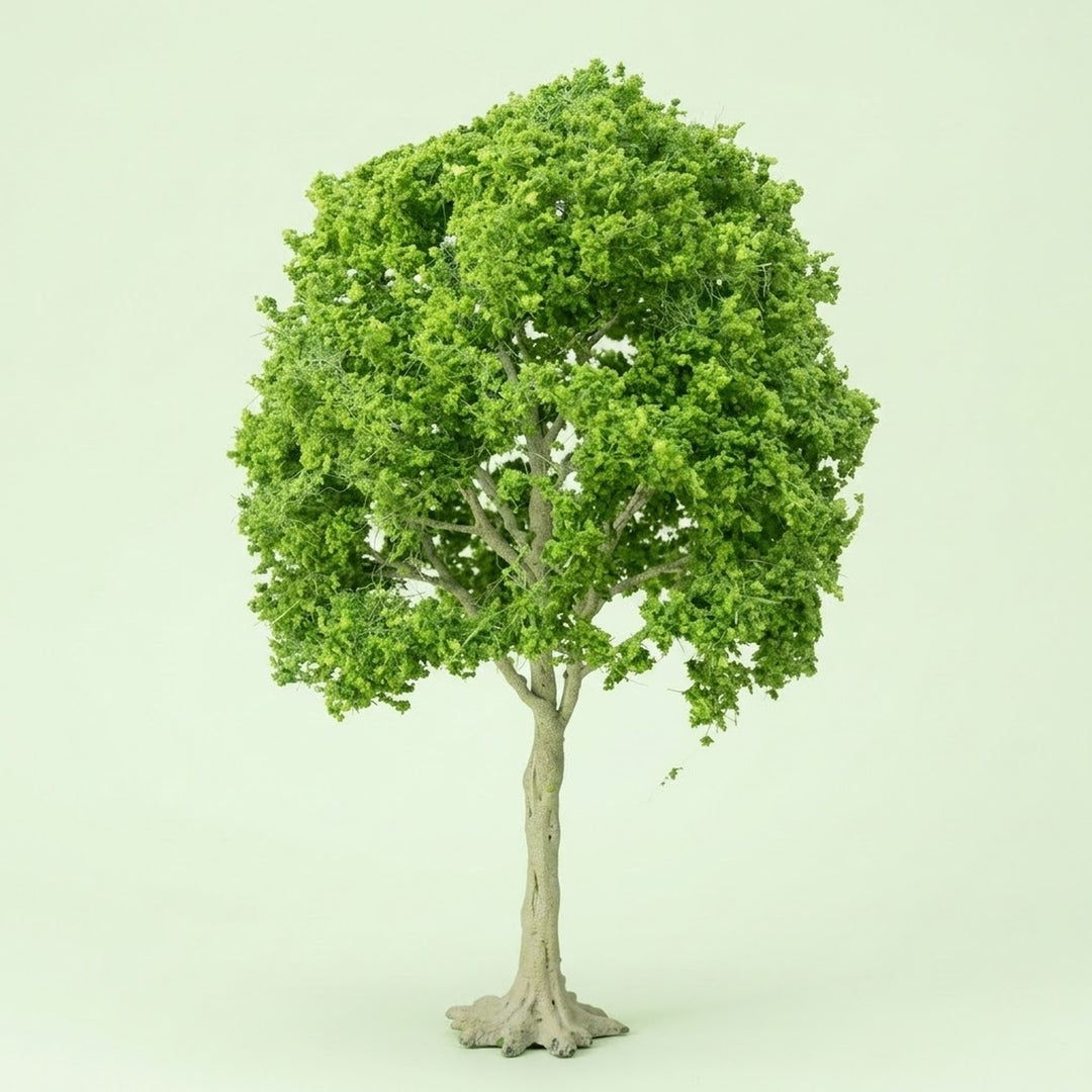 A model tree with dense light green foliage, exposed pale branches, and a tall pale trunk stands against a pale green background.