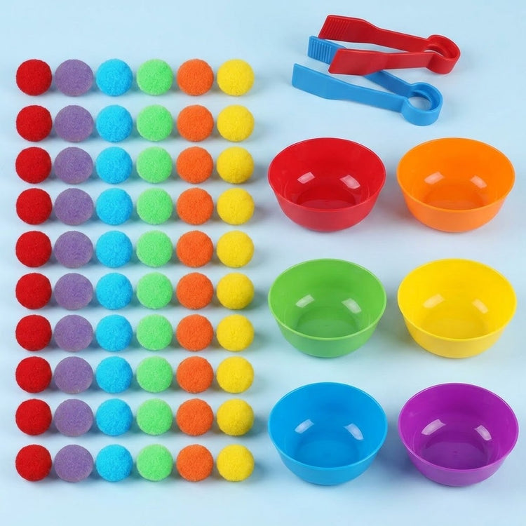 Sorting toy set with six coloured columns of pom-poms beside rainbow plastic bowls and red and blue tweezers on a pale blue background.