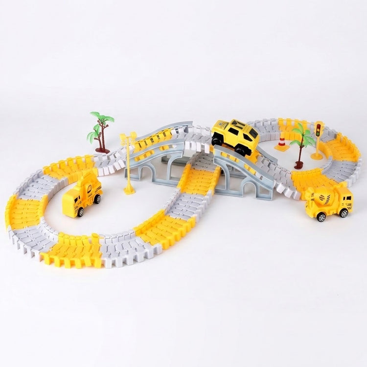 Yellow and gray car track set with a raised bridge, yellow mini car, miniature trees, and construction vehicles on a white background.