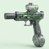 A green and smoky gray electric water gun with a cylindrical top tank and round base stands against a pale mint background.