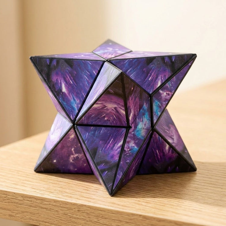 A purple and blue galaxy-patterned puzzle cube forms a pointed star shape on a wooden surface against a softly blurred background.