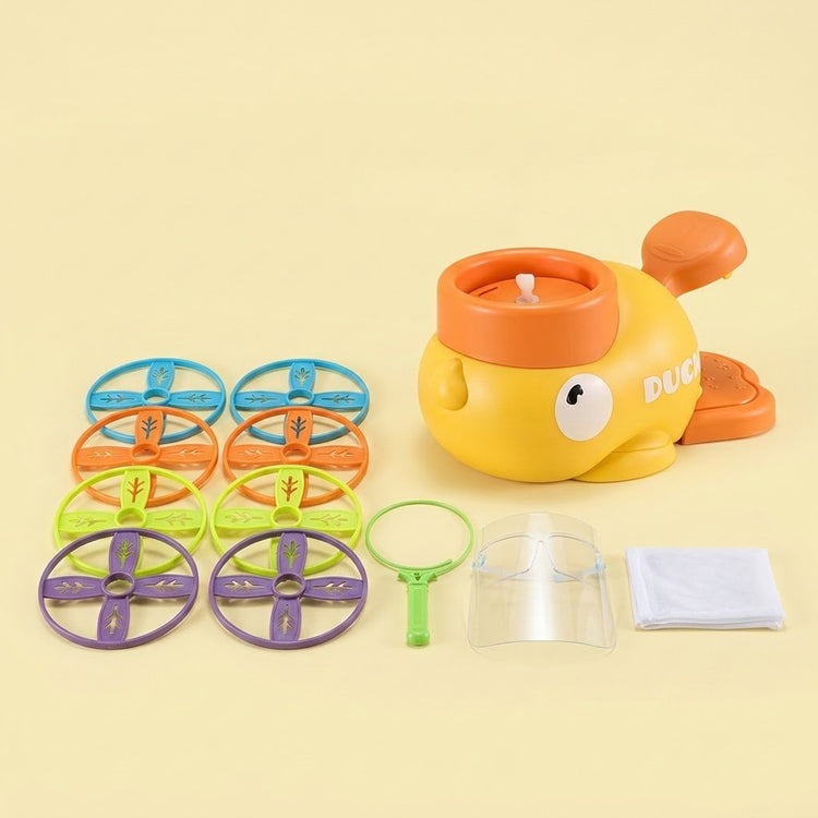 A yellow duck-shaped disc launcher with orange pedals accompanies eight colorful discs, net components, and a clear face shield against a pale yellow background.