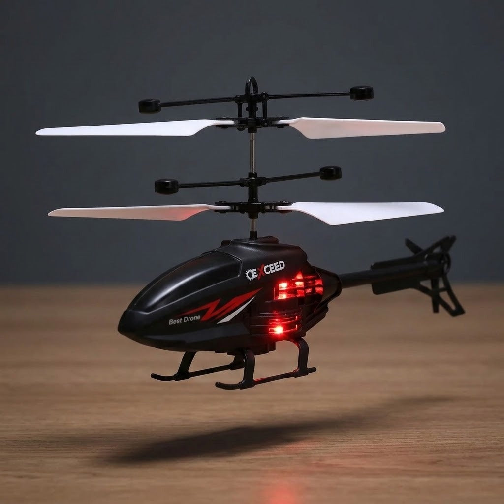 A black remote control toy helicopter with white blades and red LED lights, hovering over a wooden surface against a dark gray background.