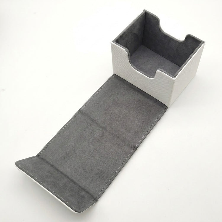 An empty white deck box with gray lining and front access cutouts rests open with its flap extended on a white background.