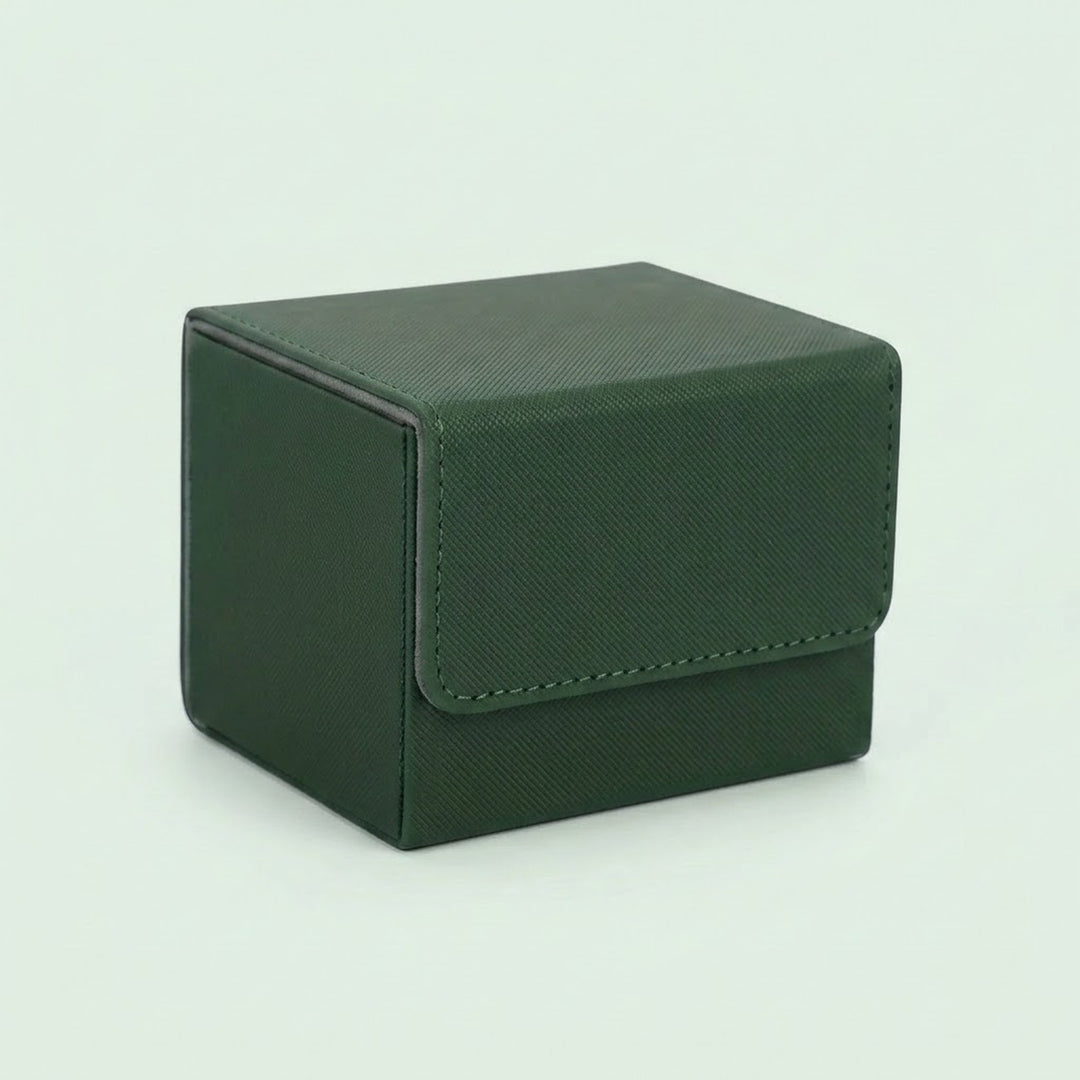 A dark green textured deck box with a closed stitched front flap sits on a pale green background.