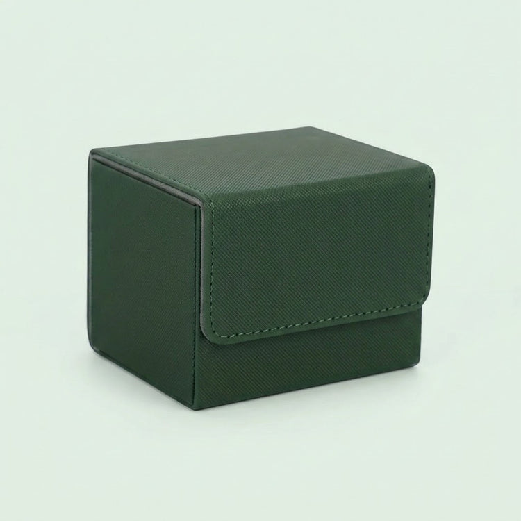 A dark green textured deck box with a closed stitched front flap sits on a pale green background.