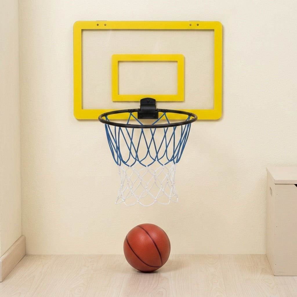 A wall-mounted mini basketball hoop with a bright yellow backboard, black rim, blue net, and white net, shown on a beige wall above a light wood floor with a basketball resting below.