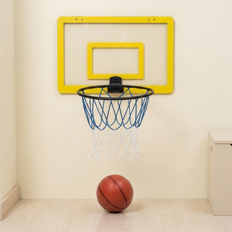 A wall-mounted mini basketball hoop with a bright yellow backboard, black rim, blue net, and white net, shown on a beige wall above a light wood floor with a basketball resting below.