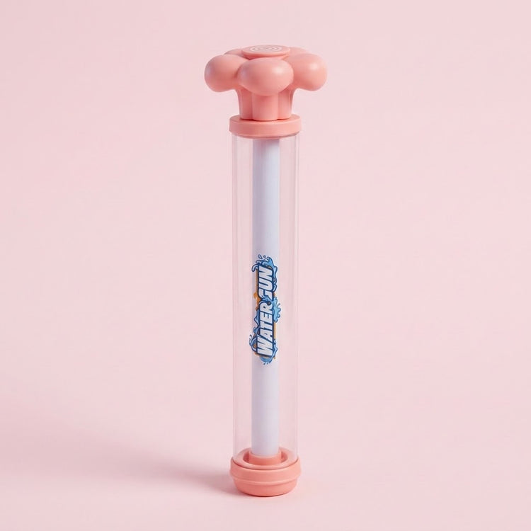A pink and clear water gun with a white inner tube and flower-shaped handle stands upright against a pale pink background.
