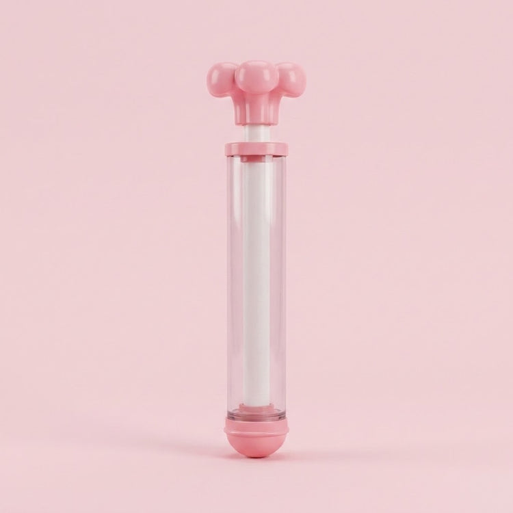 A pink and clear water gun with its flower-shaped handle slightly extended stands upright against a solid pink background.