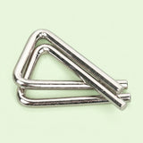 Silver metal triangular puzzle from the brain teaser set, with interlocking bent wires on a pale green background.