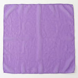 A square purple scarf with a subtle woven pattern, laid flat against a light off-white background.