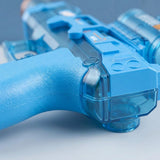 A blue electric water gun appears close up, showing its textured grip and translucent casing against a neutral gray background.