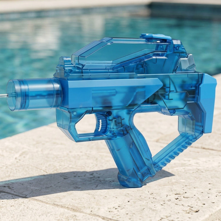 A translucent blue electric water gun with an angular body sprays water from pale stone coping beside a swimming pool.