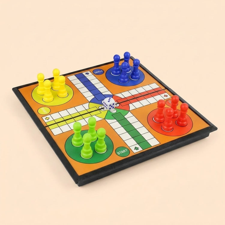 A colorful Ludo board game set with a black-bordered playmat, orange background, white grid path, green, yellow, blue, and red tokens, plus a white die, shown on a plain beige background.