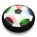 A black and white hover soccer ball with a thick black foam bumper and multicolored lights appears against a white background.
