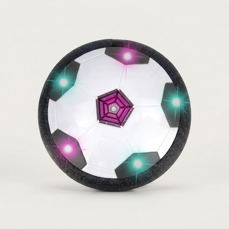 A hover soccer ball stands upright against an off-white background, showing black and white panels, a purple center, and colored lights.