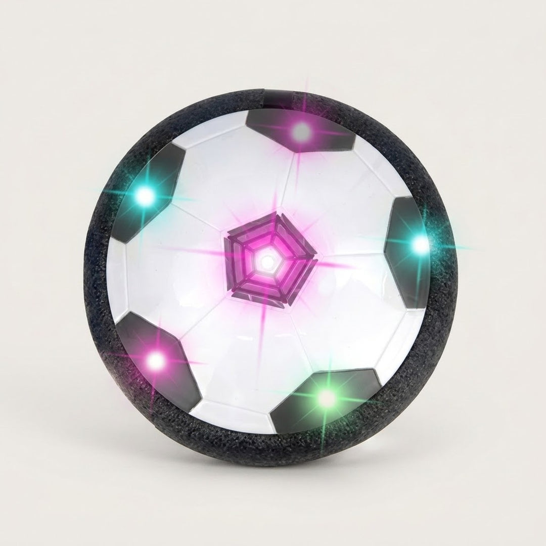 Hover soccer ball with black and white panels, a textured black foam bumper, and glowing multicoloured lights against an off-white background.