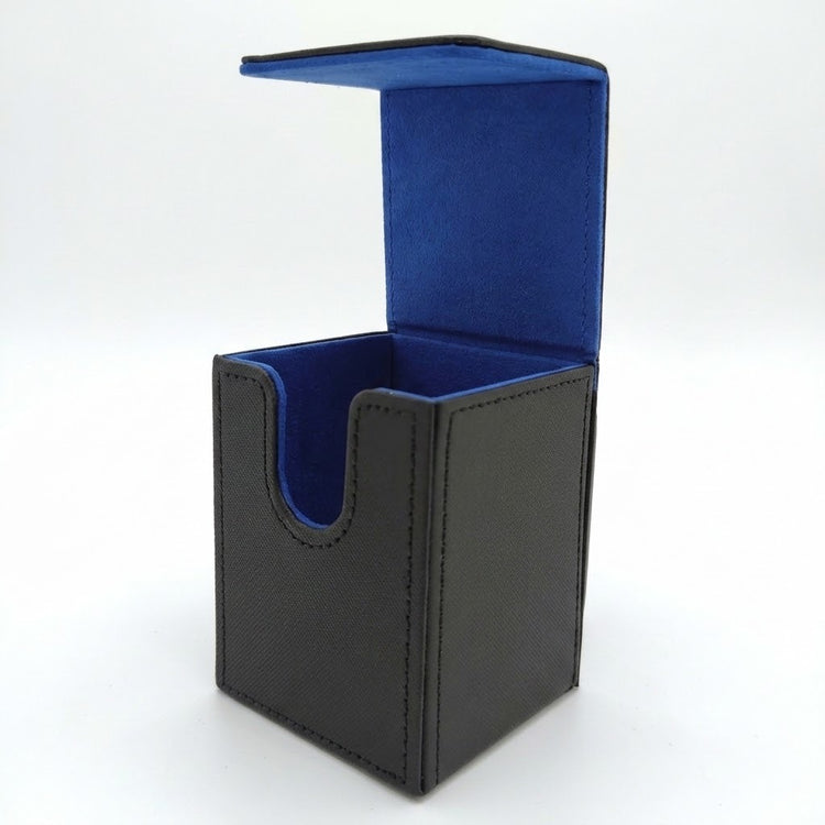 A black textured deck box stands open on a white background, revealing blue lining and a curved front cutout.