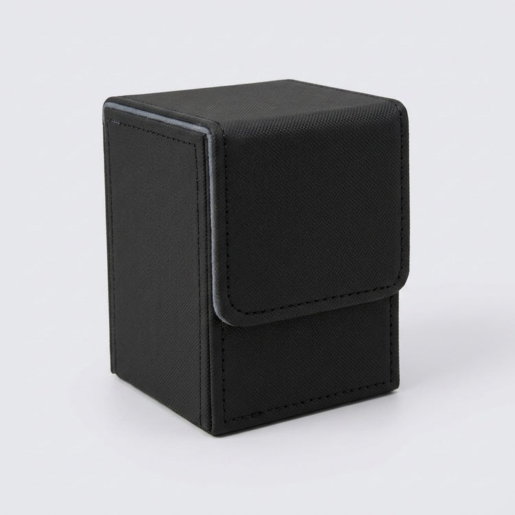 A closed black textured deck box with gray trim and a stitched front flap stands against a light gray background.