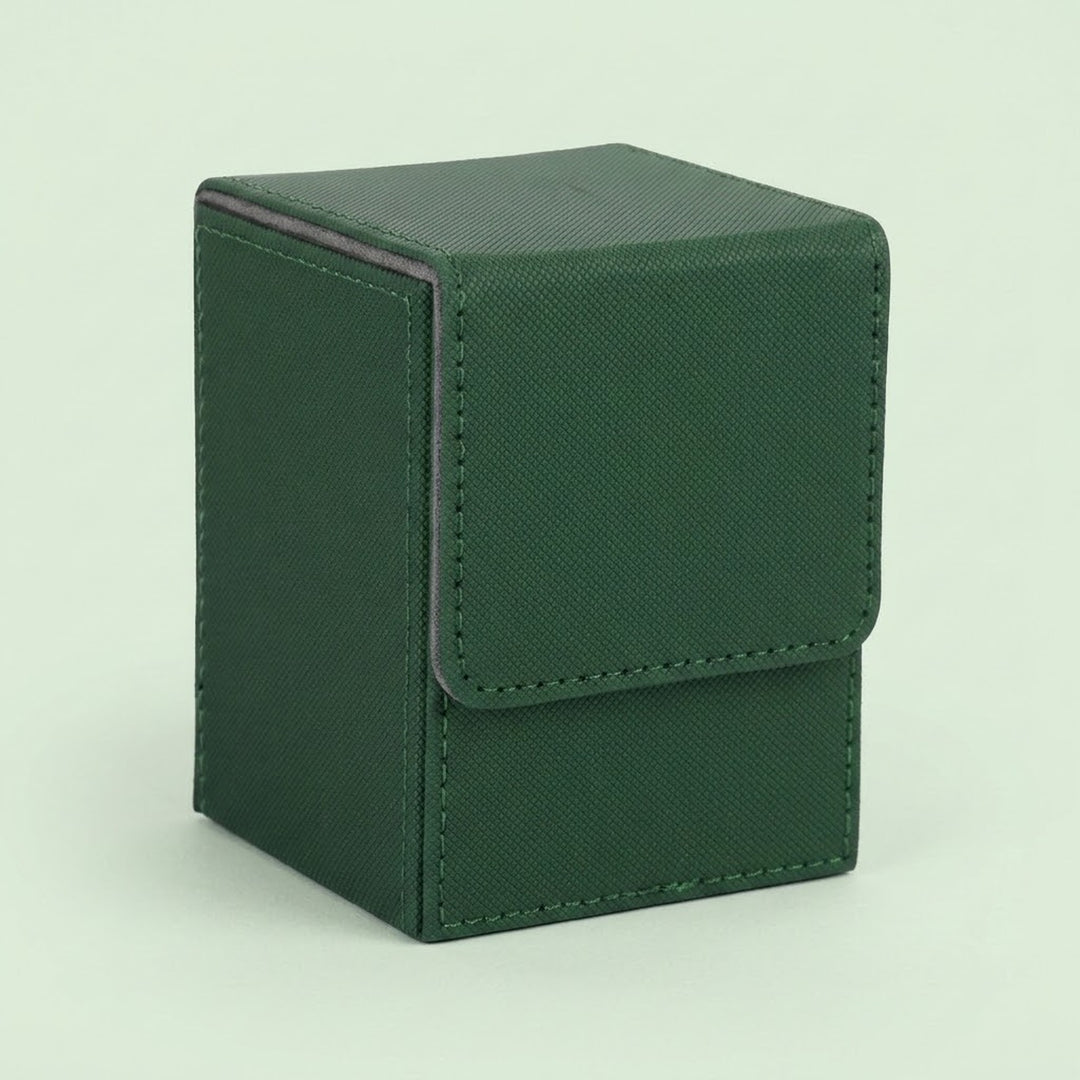 Dark green textured leather deck box with a fold-over flap and visible stitching, photographed on a plain pale background.
