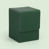 Dark green textured leather deck box with a fold-over flap and visible stitching, photographed on a plain pale background.