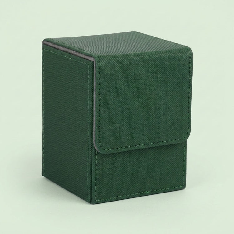 Dark green textured leather deck box with a fold-over flap and visible stitching, photographed on a plain pale background.