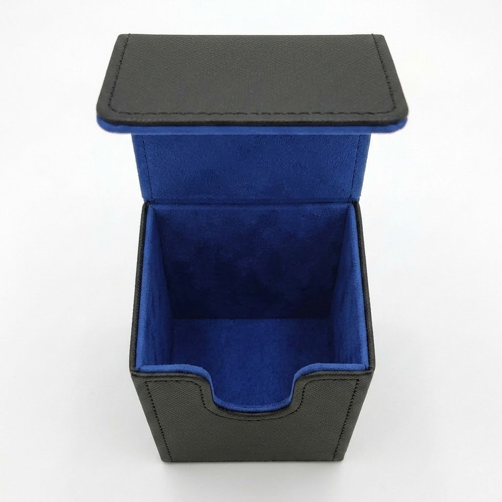 Empty open black deck box with blue lining and a U-shaped front cutout, viewed from above against a white background.
